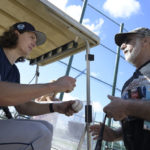 
              Tampa Bay Rays pitcher Tyler Glasnow, left, signs an autograph for a fan during the first practice for pitchers and catchers at spring training baseball camp, Wednesday, Feb. 15, 2023, in Kissimmee, Fla. (AP Photo/Phelan M. Ebenhack)
            