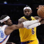
              Los Angeles Lakers forward LeBron James, right, is fouled by Oklahoma City Thunder guard Shai Gilgeous-Alexander during the second half of an NBA basketball game Tuesday, Feb. 7, 2023, in Los Angeles. (AP Photo/Ashley Landis)
            