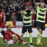 
              Manchester City's Ilkay Gundogan, second right, and Manchester City's Erling Haaland, right, react after missing a scoring chance during the English Premier League soccer match between Nottingham Forest and Manchester City at City ground in Nottingham, England, Saturday, Feb. 18, 2023. (AP Photo/Rui Vieira)
            
