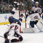 
              Columbus Blue Jackets defenseman Erik Gudbranson (44) falls to the ice during the first period of the team's NHL hockey game against the Dallas Stars in Dallas, Saturday, Feb. 18, 2023. (AP Photo/LM Otero)
            