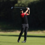 
              Tiger Woods hits from the fairway on the 12th hole during the final round of the Genesis Invitational golf tournament at Riviera Country Club, Sunday, Feb. 19, 2023, in the Pacific Palisades area of Los Angeles. (AP Photo/Ryan Kang)
            