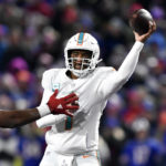 
              FILE - Miami Dolphins quarterback Tua Tagovailoa throws a pass during the first half of the team's NFL football game against the Buffalo Bills in Orchard Park, N.Y., Dec. 17, 2022. Miami made the playoffs despite starting three different quarterbacks with Tagovailoa, Teddy Bridgewater and rookie Skylar Thompson each starting at least two games during the regular season. (AP Photo/Adrian Kraus, File)
            