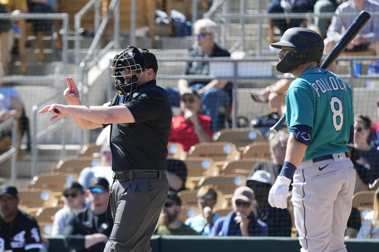 Home plate umpire Paul Clemons, left, calls a pitching clock violation against Chicago White Sox re...