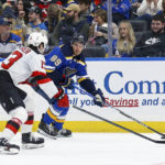
              St. Louis Blues' Pavel Buchnevich (89) looks to pass the puck while under pressure from New Jersey Devils' Nico Hischier (13) during the second period of an NHL hockey game Thursday, Feb. 16, 2023, in St. Louis. (AP Photo/Scott Kane)
            