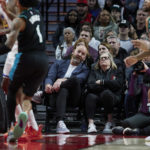 
              Portland Trail Blazers general manager Joe Cronin, left, and owner Jody Allen watch during the first half of the team's NBA basketball game against the Golden State Warriors in Portland, Ore., Wednesday, Feb. 8, 2023. (AP Photo/Craig Mitchelldyer)
            