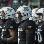 
              FILE - Marshall players wear a "75" decal on their helmets as they take the field for an NCAA college football game against Middle Tennessee on Nov. 14, 2020, in Huntington, W.Va. The game took place on the 50th anniversary of the 1970 Marshall plane crash that killed all 75 persons aboard. The plane was carrying the Marshall University football team who were returning after a game against East Carolina. A bill has won final legislative approval Wednesday, Feb. 15, 2023, in West Virginia, that would establish an annual day of recognition for the worst sports disaster in U.S. history. (Sholten Singer/The Herald-Dispatch via AP, File)
            