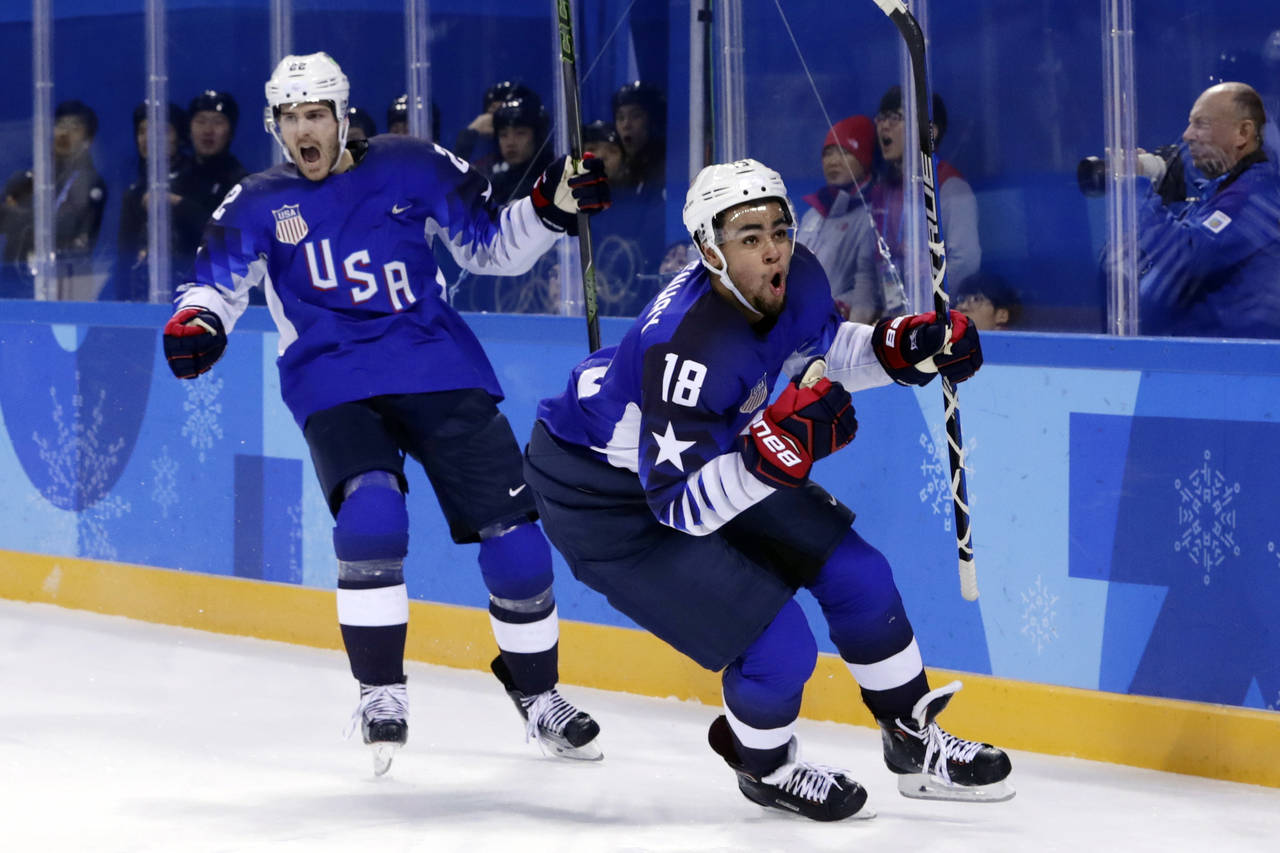 FILE -  Jordan Greenway (18), of the United States, celebrates with teammate Bobby Sanguinetti (22)...