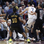 
              Memphis Grizzlies forward Dillon Brooks lays on the ground during a fight with Cleveland Cavaliers guard Donovan Mitchell (45) during the second half of an NBA basketball game, Thursday, Feb. 2, 2023, in Cleveland. Mitchell and Brooks were ejected from the game. (AP Photo/Ron Schwane)
            