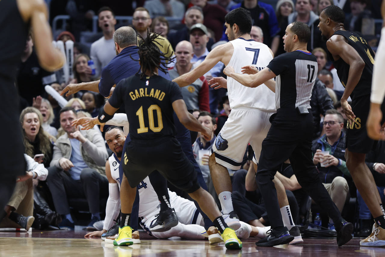 Memphis Grizzlies forward Dillon Brooks lays on the ground during a fight with Cleveland Cavaliers ...