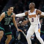 
              Phoenix Suns' Chris Paul (3) keeps the ball away from Boston Celtics' Malcolm Brogdon (13) during the first half of an NBA basketball game, Friday, Feb. 3, 2023, in Boston. (AP Photo/Michael Dwyer)
            