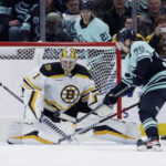 
              Seattle Kraken right wing Jesper Froden (38) shoots with Boston Bruins goaltender Jeremy Swayman (1) defending during the first period of an NHL hockey game Thursday, Feb. 23, 2023, in Seattle. (AP Photo/John Froschauer)
            