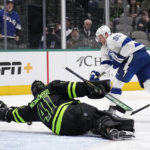 
              Dallas Stars goaltender Scott Wedgewood (41) dives to make a stop on a shot by Tampa Bay Lightning center Steven Stamkos (91) in the second period of an NHL hockey game, Saturday, Feb. 11, 2023, in Dallas. (AP Photo/Tony Gutierrez)
            