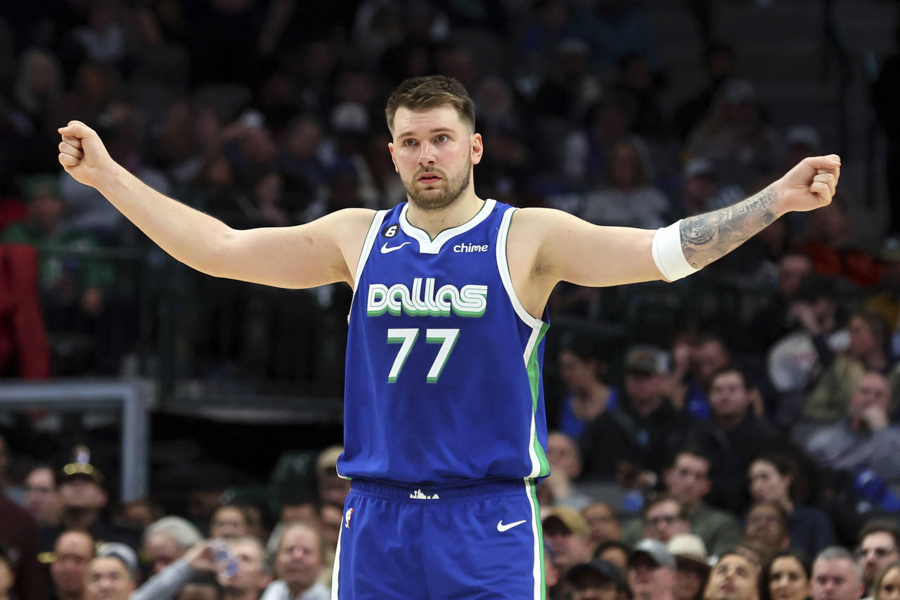 Dallas Mavericks guard Luka Doncic gestures on the court in the second half of an NBA basketball ga...