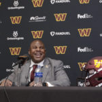
              Eric Bieniemy talks after being introduced as the new offensive coordinator and assistant head coach of the Washington Commanders during an NFL football press conference in Ashburn, Va., Thursday, Feb. 23, 2023. (AP Photo/Luis M. Alvarez)
            