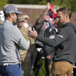 
              Aaron Rodgers, left, talks with Alex Smith before the start of the putting challenge event of the AT&T Pebble Beach Pro-Am golf tournament in Pebble Beach, Calif., Wednesday, Feb. 1, 2023. (AP Photo/Eric Risberg)
            