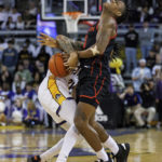 
              Houston's Marcus Sasser, right, and East Carolina's Jaden Walker vie for the ball during the first half of an NCAA college basketball game in Greenville, N.C., Saturday, Feb. 25, 2023. (AP Photo/Ben McKeown)
            