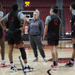 
              UNLV women's NCAA college basketball head coach Lindy La Rocque, center, speaks with players during practice Wednesday, Feb. 15, 2023, in Las Vegas. La Rocque is in her third season at UNLV, and she keeps taking the program up a step each year.(AP Photo/John Locher)
            
