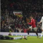 
              Manchester United's Marcus Rashford, centre celebrates and runs to get the ball after scoring his sides first goal of the game during the English Premier League soccer match between Manchester United and Leeds United at Old Trafford in Manchester, England, Wednesday, Feb. 8, 2023. (AP Photo/Dave Thompson)
            