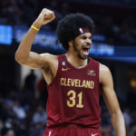 
              Cleveland Cavaliers center Jarrett Allen celebrates after a call during the second half of an NBA basketball game against the San Antonio Spurs, Monday, Feb. 13, 2023, in Cleveland. (AP Photo/Ron Schwane)
            