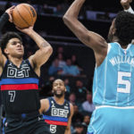 
              Detroit Pistons guard Killian Hayes (7) shoots the ball while defended by Charlotte Hornets center Mark Williams (5) during the first half of an NBA basketball game in Charlotte, N.C., Monday, Feb. 27, 2023. (AP Photo/Jacob Kupferman)
            