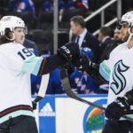 
              Seattle Kraken's Jared McCann (19) celebrates with teammate Alex Wennberg (21) after scoring during the third period of an NHL hockey game against the New York Rangers, Friday, Feb. 10, 2023, in New York. (AP Photo/Frank Franklin II)
            