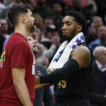
              Cleveland Cavaliers guard Donovan Mitchell walks to the locker room after fighting with Memphis Grizzlies forward Dillon Brooks during the second half of an NBA basketball game, Thursday, Feb. 2, 2023, in Cleveland. Mitchell and Brooks were ejected from the game. (AP Photo/Ron Schwane)
            