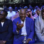 
              Mike Tyson, center, attends the boxing match between Jake Paul and Tommy Fury in Riyadh, Saudi Arabia, late Sunday, Feb. 26, 2023. (AP Photo)
            