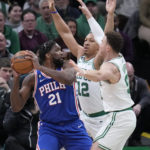 
              Philadelphia 76ers center Joel Embiid (21) is trapped by Boston Celtics' Grant Williams (12) and Blake Griffin, right, during the first half of an NBA basketball game, Wednesday, Feb. 8, 2023, in Boston. (AP Photo/Charles Krupa)
            