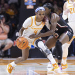 
              Tennessee guard Jordan Walker (4) drives as she is defended by South Carolina guard Raven Johnson during the first half of an NCAA college basketball game, Thursday, Feb. 23, 2023, in Knoxville, Tenn. (AP Photo/Wade Payne)
            