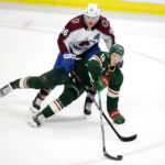 
              Minnesota Wild left wing Matt Boldy (12) and Colorado Avalanche right wing Mikko Rantanen (96) compete for the puck during the third period of an NHL hockey game Wednesday, Feb. 15, 2023, in St. Paul, Minn. (AP Photo/Andy Clayton-King)
            