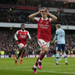 
              Arsenal's Leandro Trossard celebrates after scoring the opening goal during the English Premier League soccer match between Arsenal and Brentford at Emirates stadium in London, Saturday, Feb. 11, 2023. (AP Photo/Frank Augstein)
            