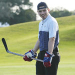 
              Nick Suzuki of the Montreal Canadiens, looks back at the crowd after his shot landed on the green during a golf skills competition using hockey sticks, Wednesday, Feb. 1, 2023, in Plantation, Fla. The event was part of the NHL All Star weekend. (AP Photo/Marta Lavandier)
            