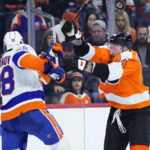 
              Philadelphia Flyers' Nicolas Deslauriers, right, and New York Islanders' Alexander Romanov collide during the second period of an NHL hockey game, Monday, Feb. 6, 2023, in Philadelphia. (AP Photo/Matt Slocum)
            