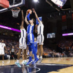 
              Duke's Kyle Filipowski (30) goes up for a basket defended by Virginia's Kihei Clark (0) during the first half of an NCAA college basketball game in Charlottesville, Va., Saturday, Feb. 11, 2023. (AP Photo/Mike Kropf)
            