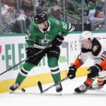 
              Dallas Stars center Wyatt Johnston (53) and Anaheim Ducks defenseman Simon Benoit (13) compete for control of the puck in the first period of an NHL hockey game, Monday, Feb. 6, 2023, in Dallas. (AP Photo/Tony Gutierrez)
            