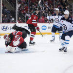 
              Winnipeg Jets' Cole Perfetti (91) turns after scoring a goal against New Jersey Devils goaltender Mackenzie Blackwood (29) during the first period of an NHL hockey game Sunday, Feb. 19, 2023, in Newark, N.J. (AP Photo/Frank Franklin II)
            