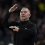 
              Denver Nuggets head coach Michael Malone signals to his team during the first half of an NBA basketball game against the Minnesota Timberwolves, Sunday, Feb. 5, 2023, in Minneapolis. (AP Photo/Abbie Parr)
            