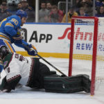 
              St. Louis Blues' Ryan O'Reilly (90) scores the game-winning goal past Arizona Coyotes goaltender Karel Vejmelka during overtime of an NHL hockey game Saturday, Feb. 11, 2023, in St. Louis. (AP Photo/Jeff Roberson)
            