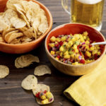 
              This image shows a recipe for tropical fruit salsa. AP food writer Katie Workman says it's extremely simple to make your own salsa for Super Bowl celebrations. All you need is a willingness to chop, mince and dice. (Cheyenne Cohen via AP)
            