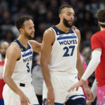 
              Minnesota Timberwolves forward Kyle Anderson (5), left, and center Rudy Gobert (27) react after a timeout was called during the second half of an NBA basketball game against the Washington Wizards, Thursday, Feb. 16, 2023, in Minneapolis. (AP Photo/Abbie Parr)
            