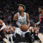 
              Boston Celtics guard Marcus Smart (36) eyes the basket on a drive during the first half of an NBA basketball game against the New York Knicks, Monday, Feb. 27, 2023, in New York. (AP Photo/John Minchillo)
            