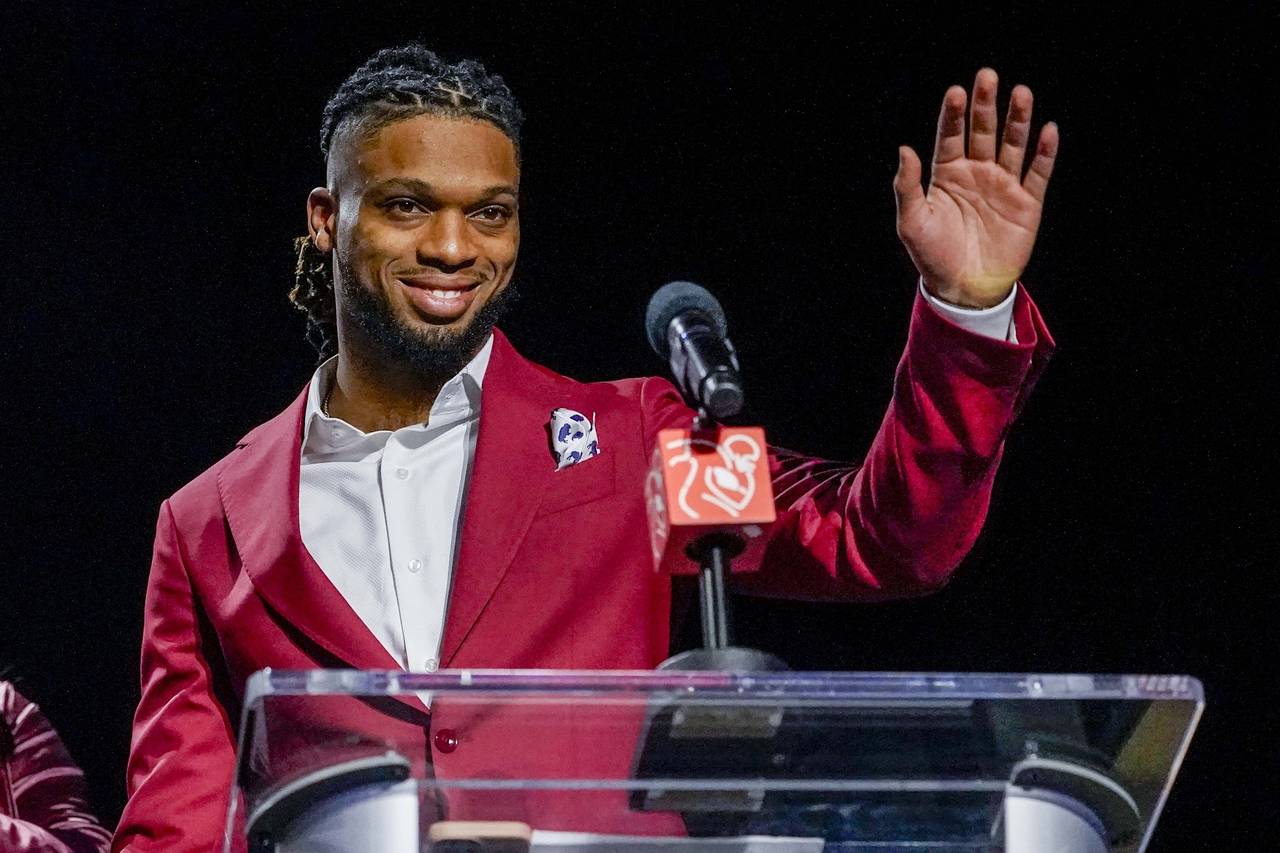Buffalo Bills' Damar Hamlin waves after being introduced as the winner of the Alan Page Community A...