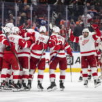 
              Detroit Red Wings celebrate a shootout win over the Edmonton Oilers in an NHL hockey game Wednesday, Feb. 15, 2023, in Edmonton, Alberta. (Jason Franson/The Canadian Press via AP)
            