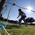 
              FILE - The goalkeeper guards the net as girls take part in the first day of tryouts for the Fort Walton Beach High School girls' soccer team in Fort Walton Beach, Fla., on Oct. 10, 2012. Questions about female athletes’ menstrual history will no longer appear on the medical forms that Florida high school students have to fill out before participating in sports, though the new form will still ask athletes for their sex assigned at birth, rather than just their sex.  The Florida High School Athletic Association axed the questions on Thursday, Feb. 9, 2023, after listening to a flood of complaints contained in letters read aloud during an emergency meeting of the board.   (Devon Ravine/Northwest Florida Daily News via AP, File)
            