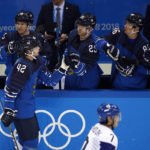 
              FILE -  Miro Heiskanen (42), of Finland, celebrates with his teammates after scoring a goal against South Korea during the second period of the qualification round of the men's hockey game at the 2018 Winter Olympics in Gangneung, South Korea, Tuesday, Feb. 20, 2018. The 2018 Olympics without NHL talent offered a glimpse of things to come for players who hadn't yet reached the best hockey league in the world. (AP Photo/Jae C. Hong File)
            