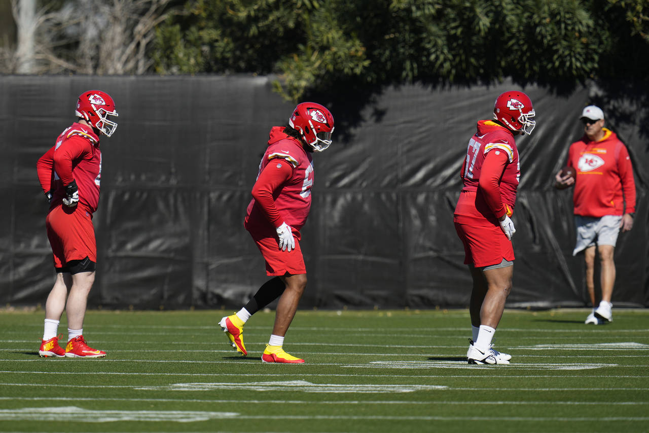 Kansas City Chiefs offensive tackles Orlando Brown Jr., right, and Lucas Niang, middle, along with ...