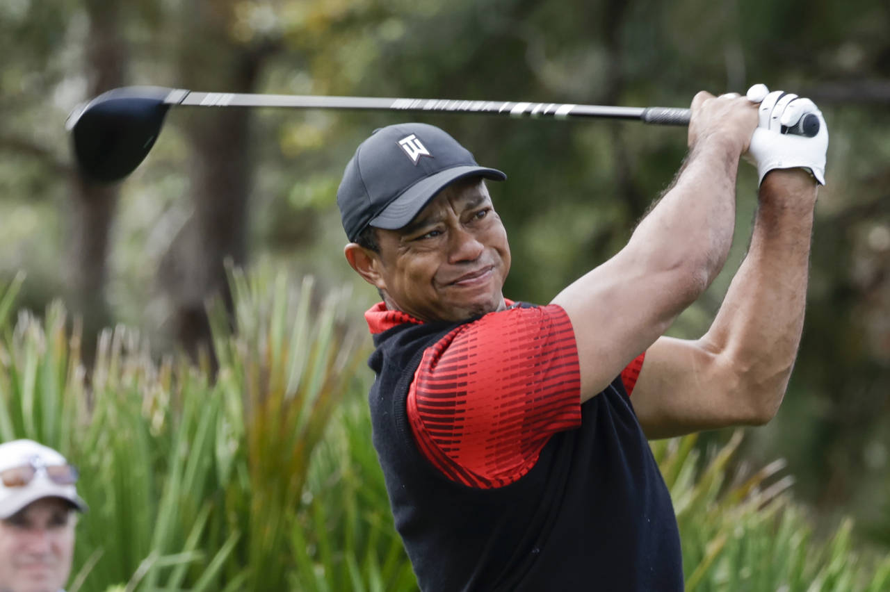 FILE - Tiger Woods tees off of the 3rd hole during the final round of the PNC Championship golf tou...