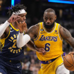 
              Los Angeles Lakers forward LeBron James (6) drives on Indiana Pacers guard Buddy Hield (24) during the first half of an NBA basketball game in Indianapolis, Thursday, Feb. 2, 2023. (AP Photo/Michael Conroy)
            