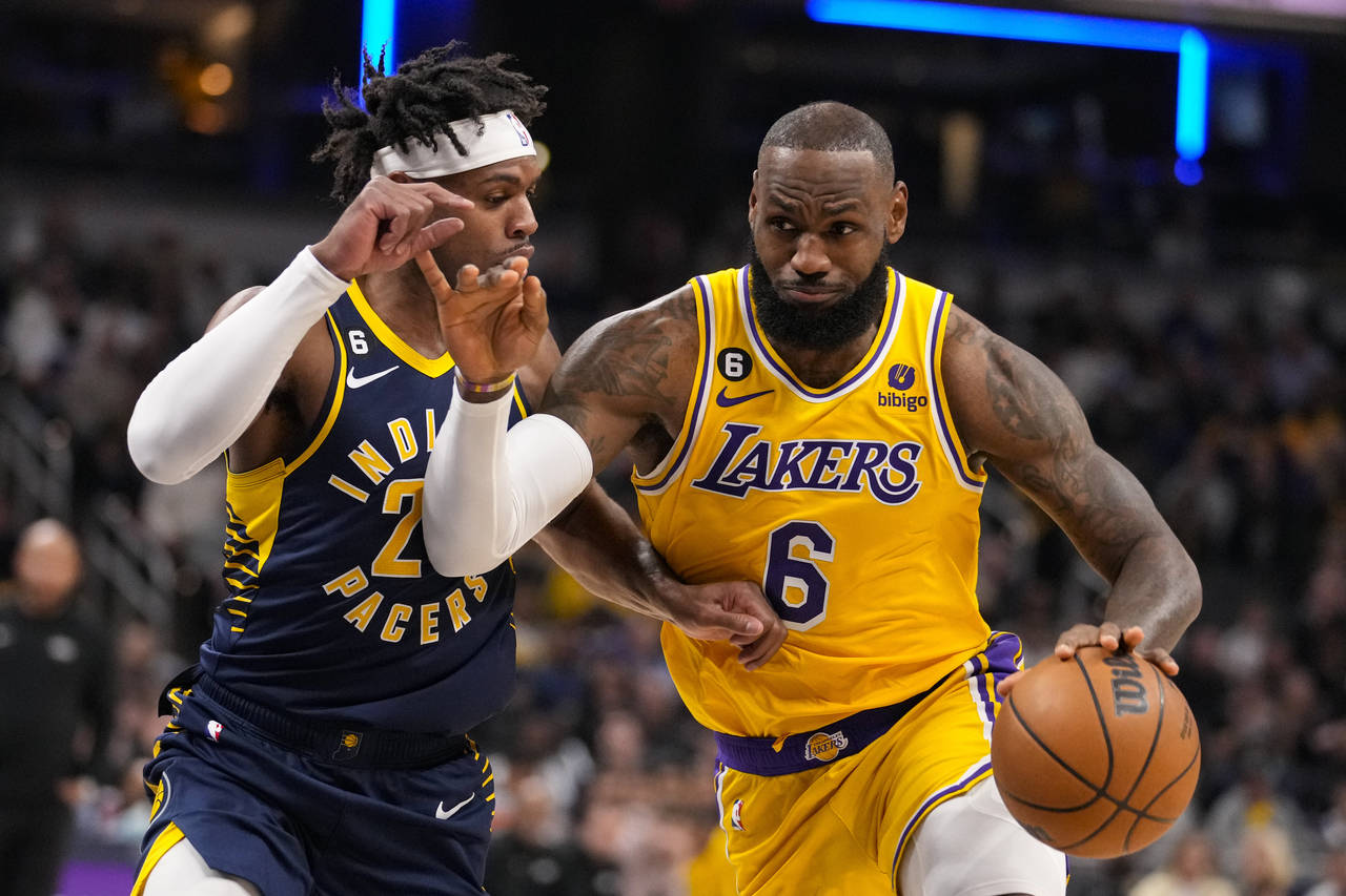 Los Angeles Lakers forward LeBron James (6) drives on Indiana Pacers guard Buddy Hield (24) during ...