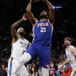 
              Philadelphia 76ers' Joel Embiid (21) shoots against Brooklyn Nets' Royce O'Neale (00) during the first quarter of an NBA basketball game Saturday, Feb. 11, 2023, in New York. (AP Photo/Jason DeCrow)
            